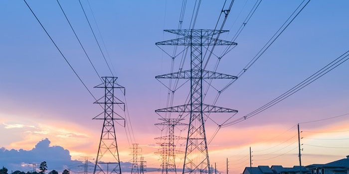 Overhead high-tension transmission conductors strung between structures